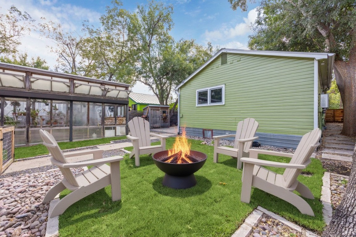1106 Fairmount Avenue Austin, TX 78704 - Photo 2 of 25 a view of a chair and fire pit in the backyard