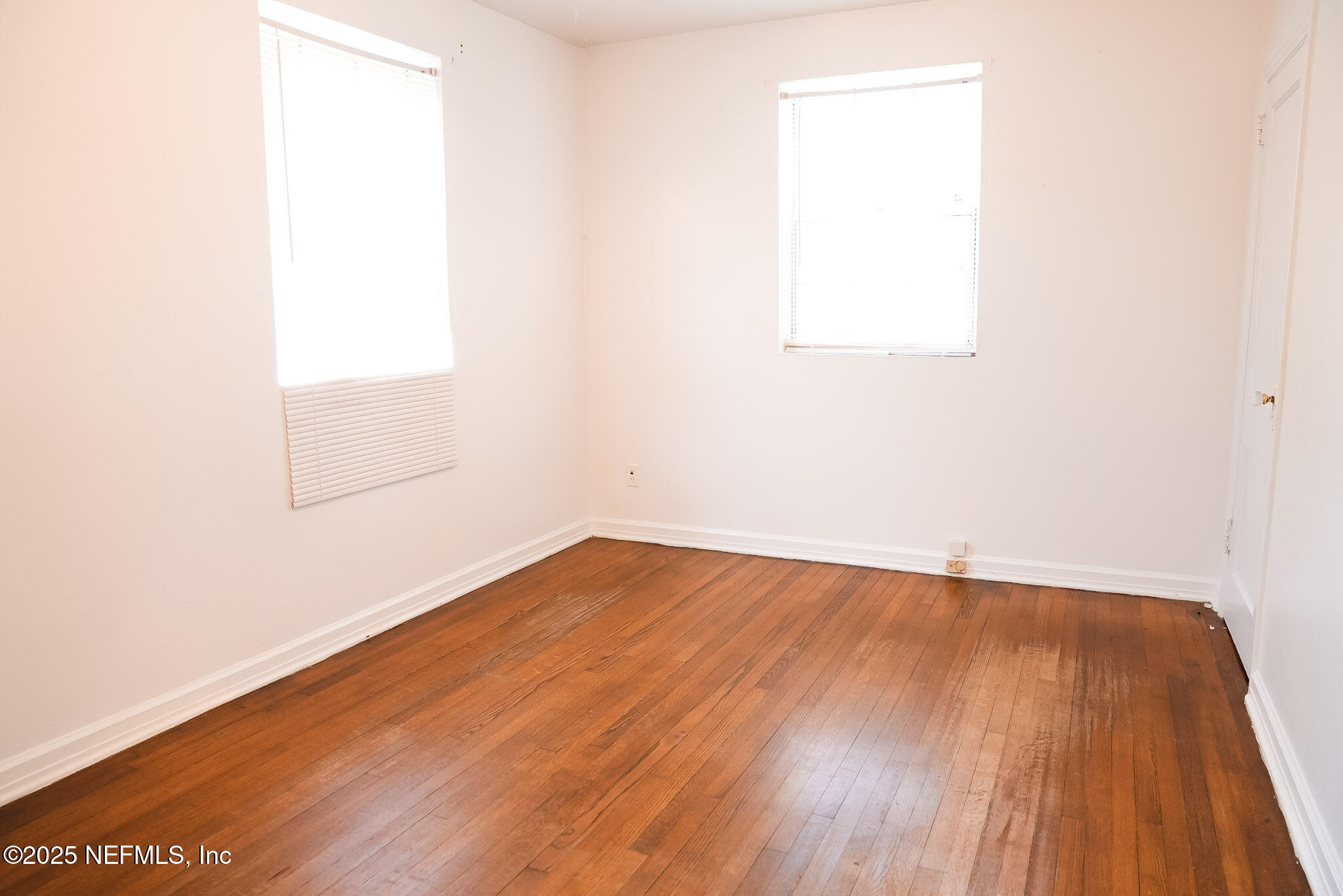 3224 Claremont Road Jacksonville, FL 32207 - Photo 13 of 26 a view of a room with wooden floor and white walls