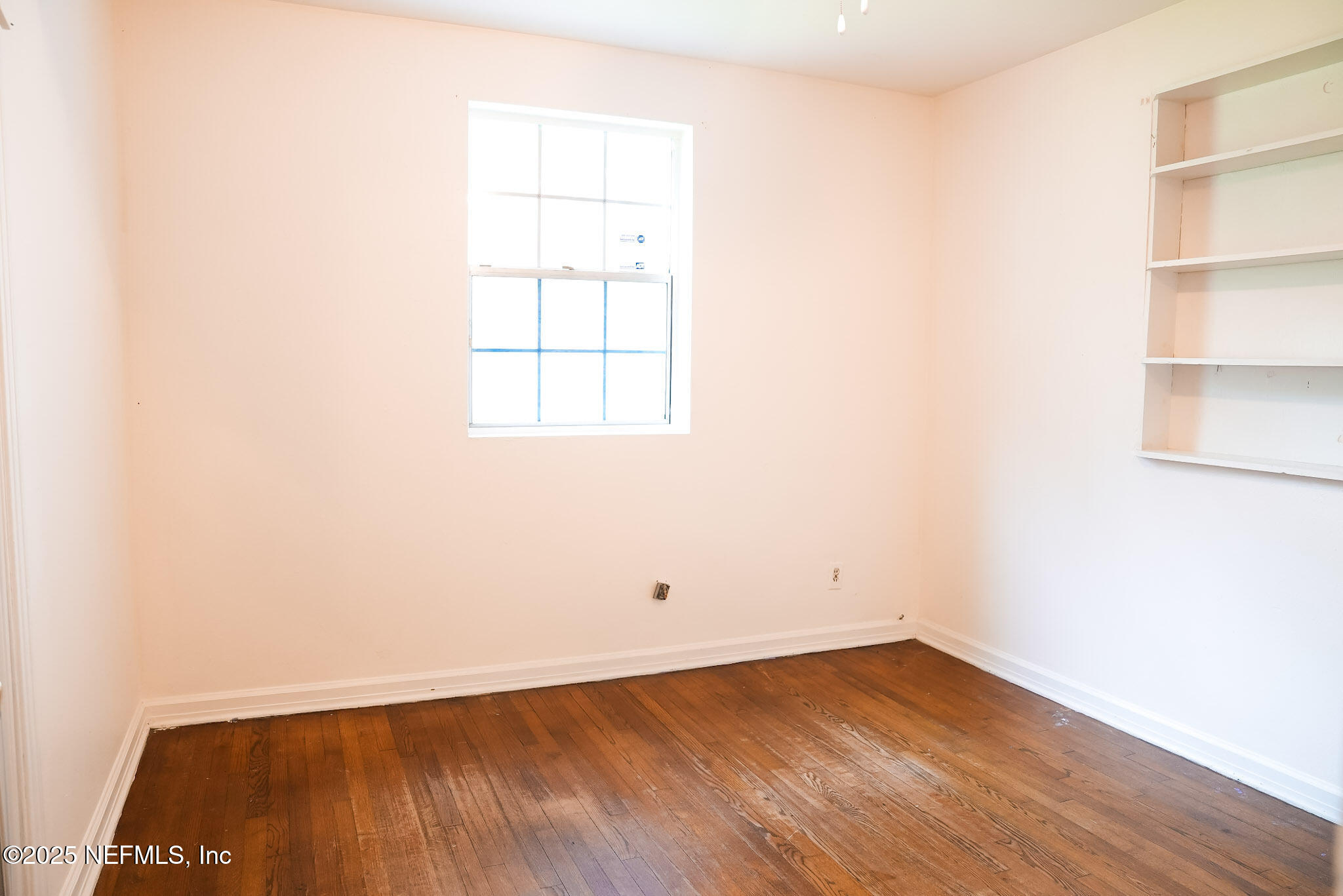 3224 Claremont Road Jacksonville, FL 32207 - Photo 14 of 26 an empty room with a hardwood and a window