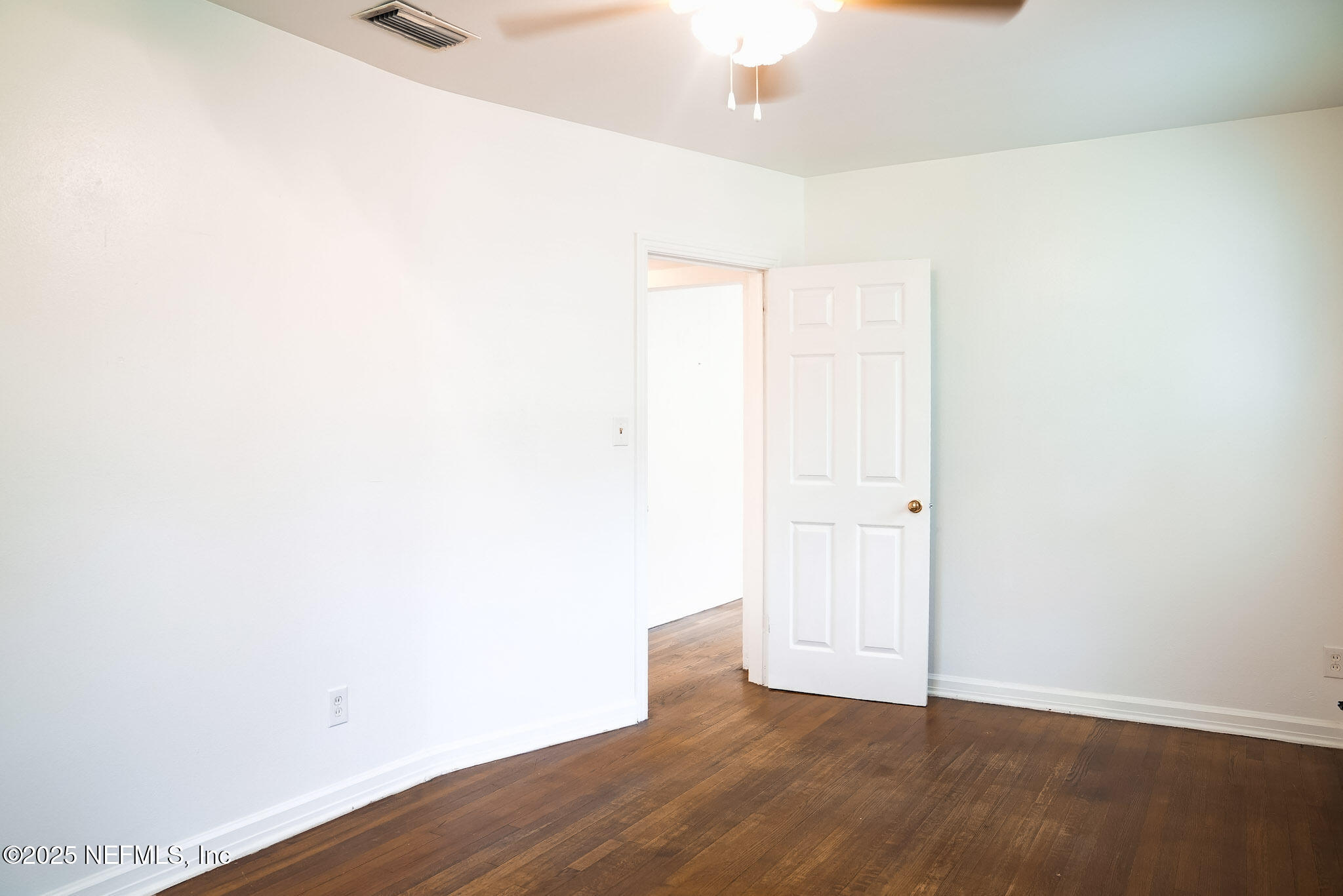 3224 Claremont Road Jacksonville, FL 32207 - Photo 15 of 26 a view of an empty room with wooden floor