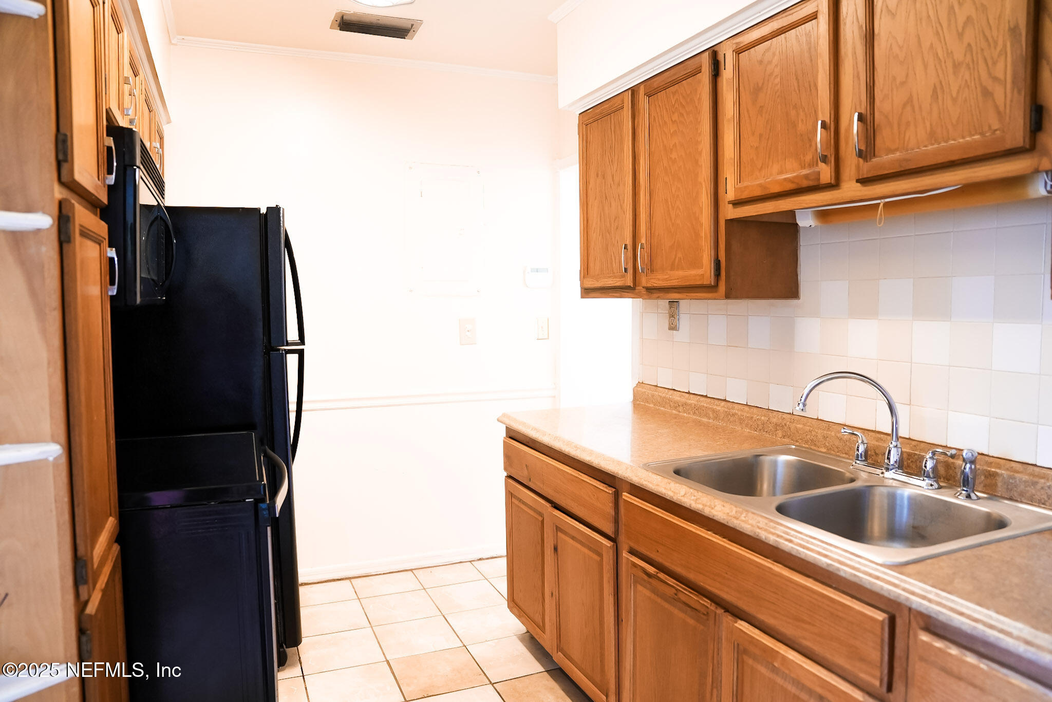 3224 Claremont Road Jacksonville, FL 32207 - Photo 16 of 26 a kitchen with stainless steel appliances granite countertop a refrigerator and a sink