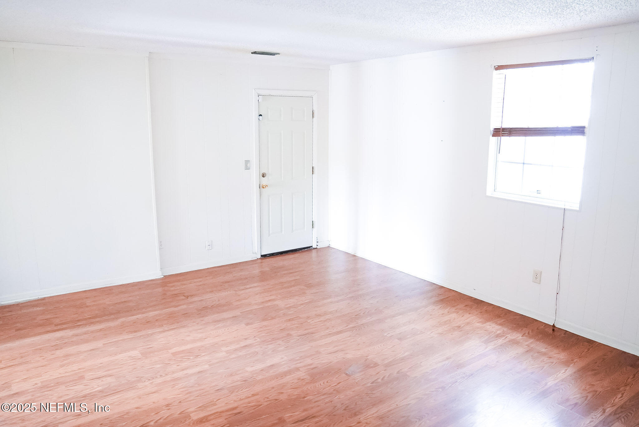 3224 Claremont Road Jacksonville, FL 32207 - Photo 22 of 26 a view of an empty room with wooden floor