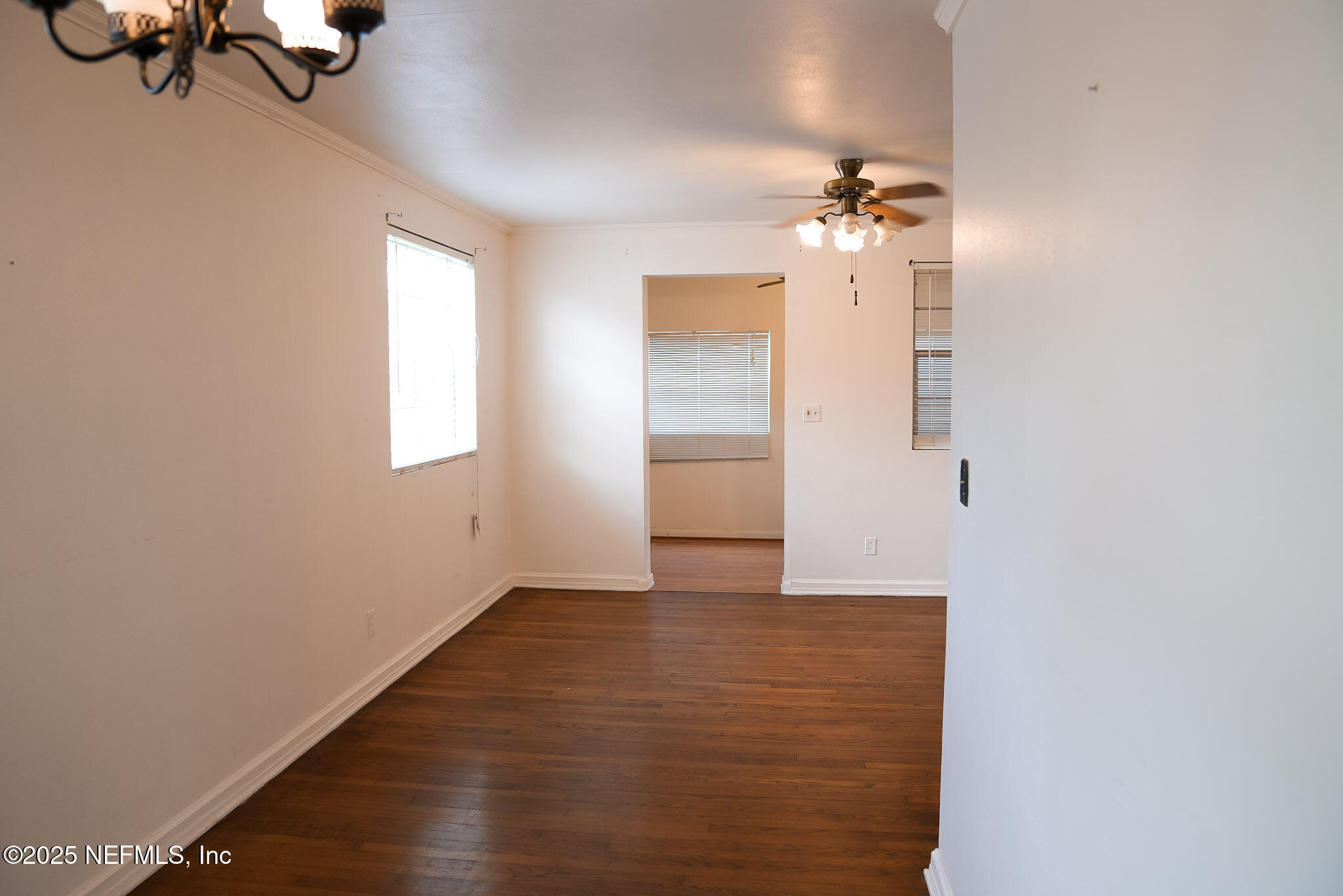 3224 Claremont Road Jacksonville, FL 32207 - Photo 7 of 26 wooden floor in an empty room with a window