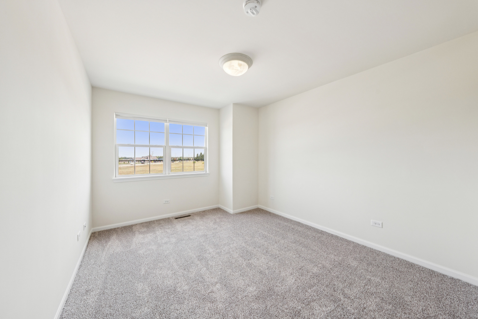 11683 Joan Avenue Huntley, IL 60142 - Photo 16 of 21 a view of an empty room with a window