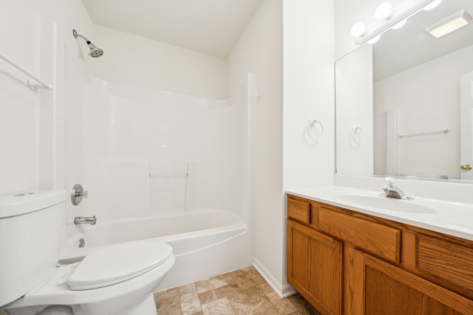 11683 Joan Avenue Huntley, IL 60142 - Photo 17 of 21 a bathroom with a sink a toilet and a bathtub