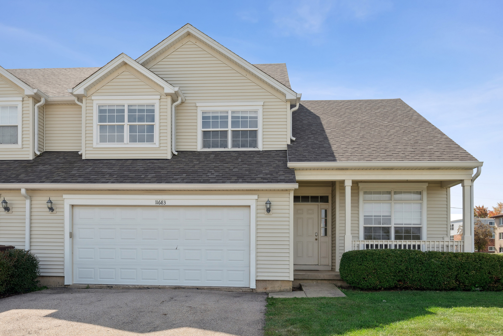 11683 Joan Avenue Huntley, IL 60142 - Photo 2 of 21 a front view of a house with a garden