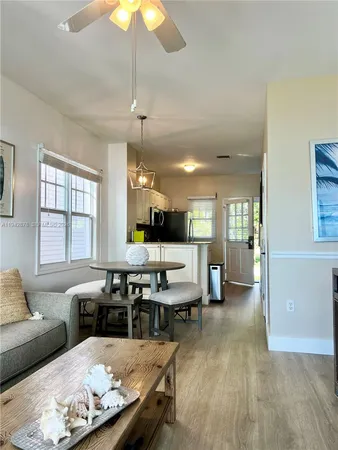 a kitchen with stainless steel appliances granite countertop a refrigerator a stove a sink and a microwave