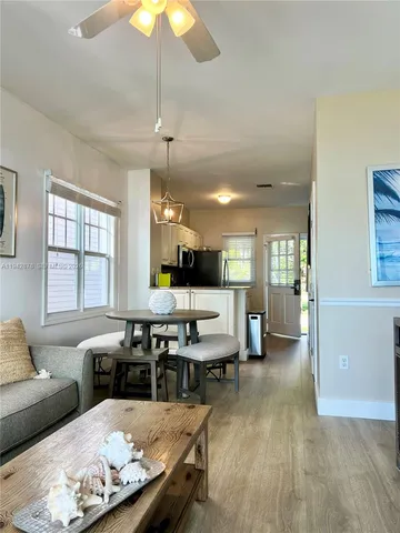 a kitchen with stainless steel appliances granite countertop a refrigerator a stove a sink and a microwave