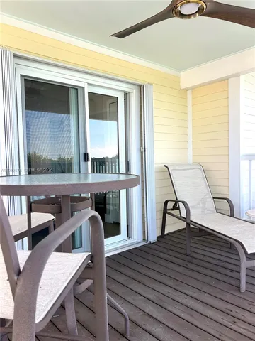 a terrace with outdoor seating and city view