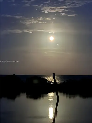 a view of a house with a yard and deck