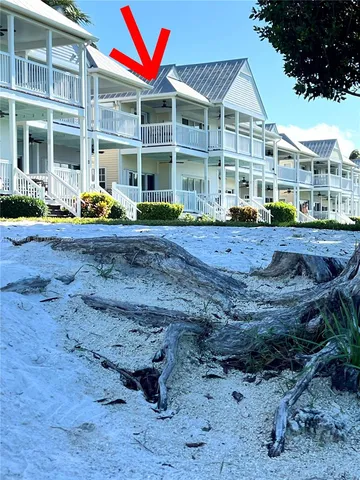 a view of a house with a yard and deck