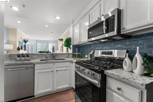 a kitchen with a sink and a refrigerator
