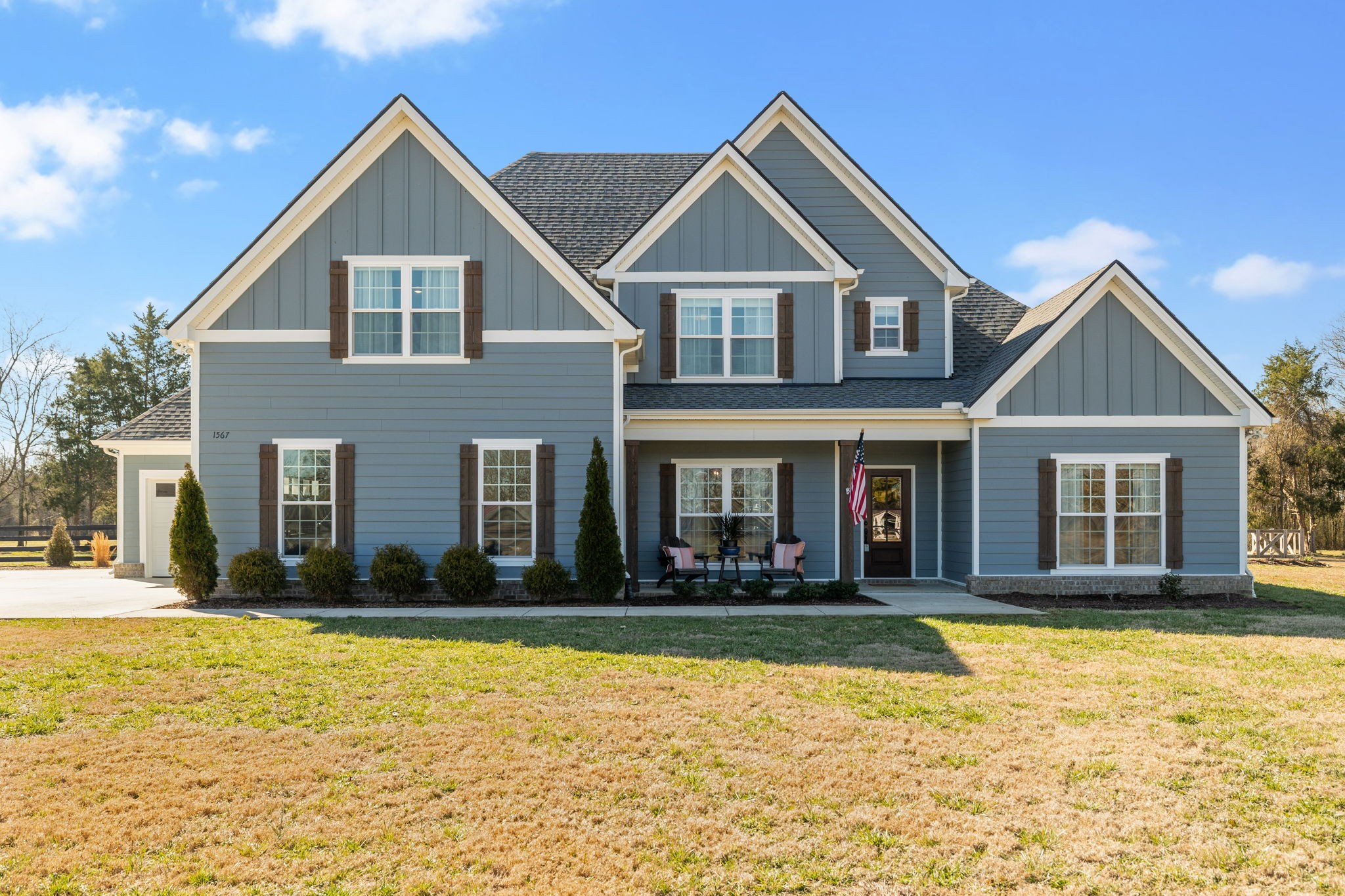 1567 Harrison Road Murfreesboro, TN 37128 - Photo 1 of 56 a front view of a house with a yard