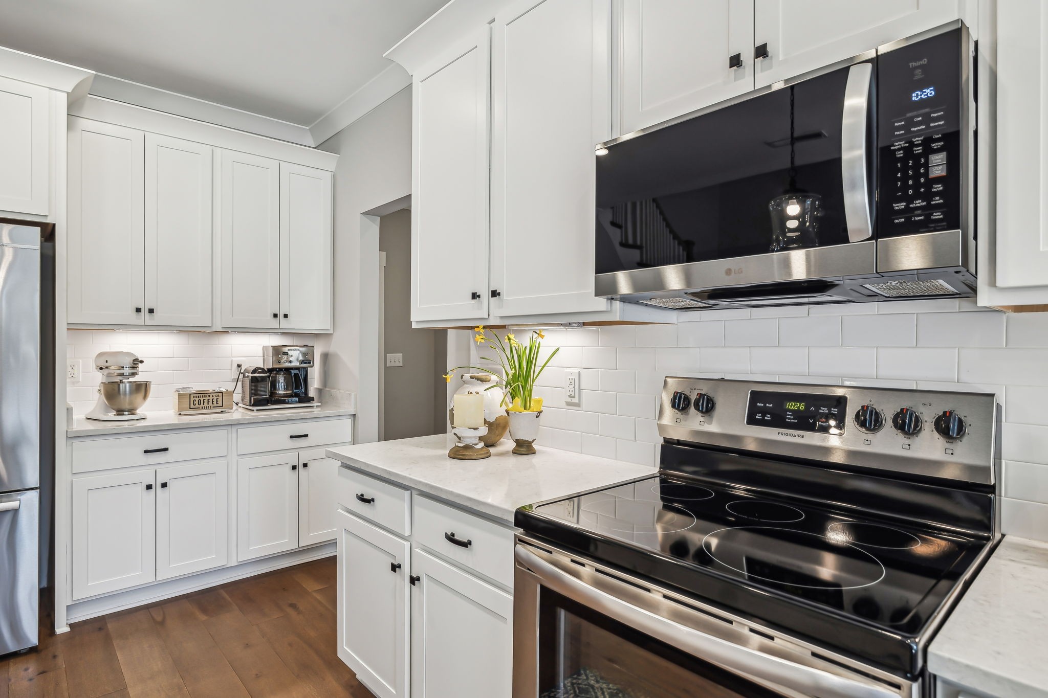 1567 Harrison Road Murfreesboro, TN 37128 - Photo 22 of 56 a kitchen with a stove and a microwave