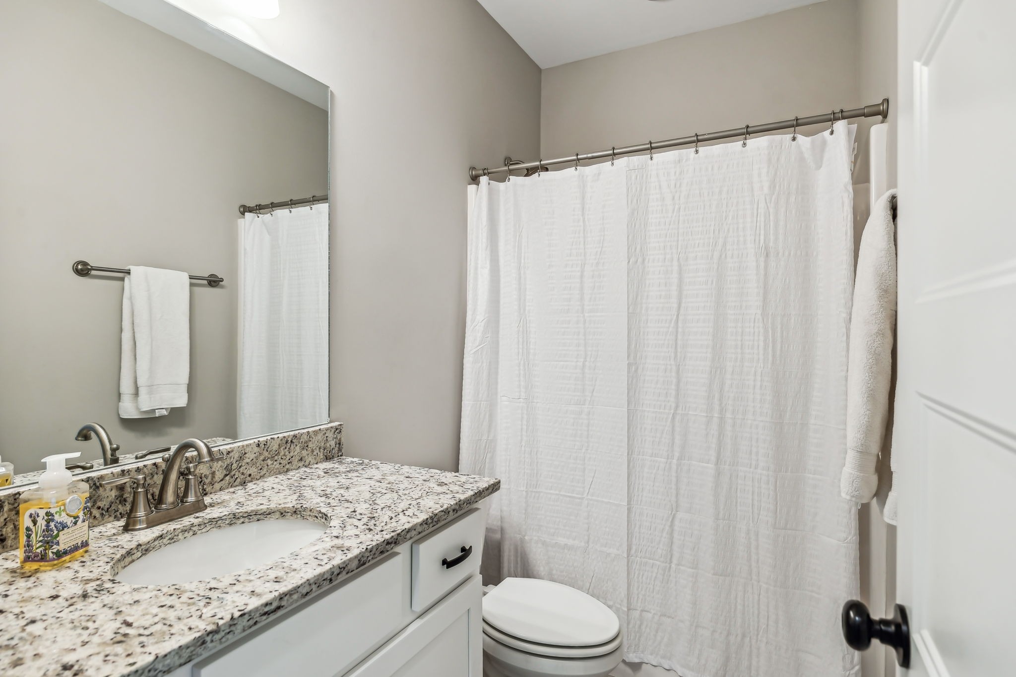 1567 Harrison Road Murfreesboro, TN 37128 - Photo 25 of 56 a bathroom with a granite countertop sink and a mirror