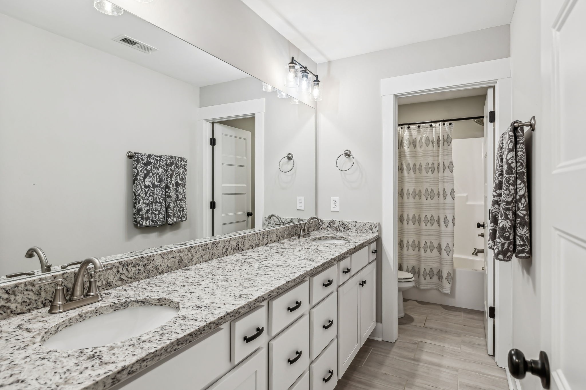 1567 Harrison Road Murfreesboro, TN 37128 - Photo 33 of 56 a bathroom with a granite countertop sink mirror and double
