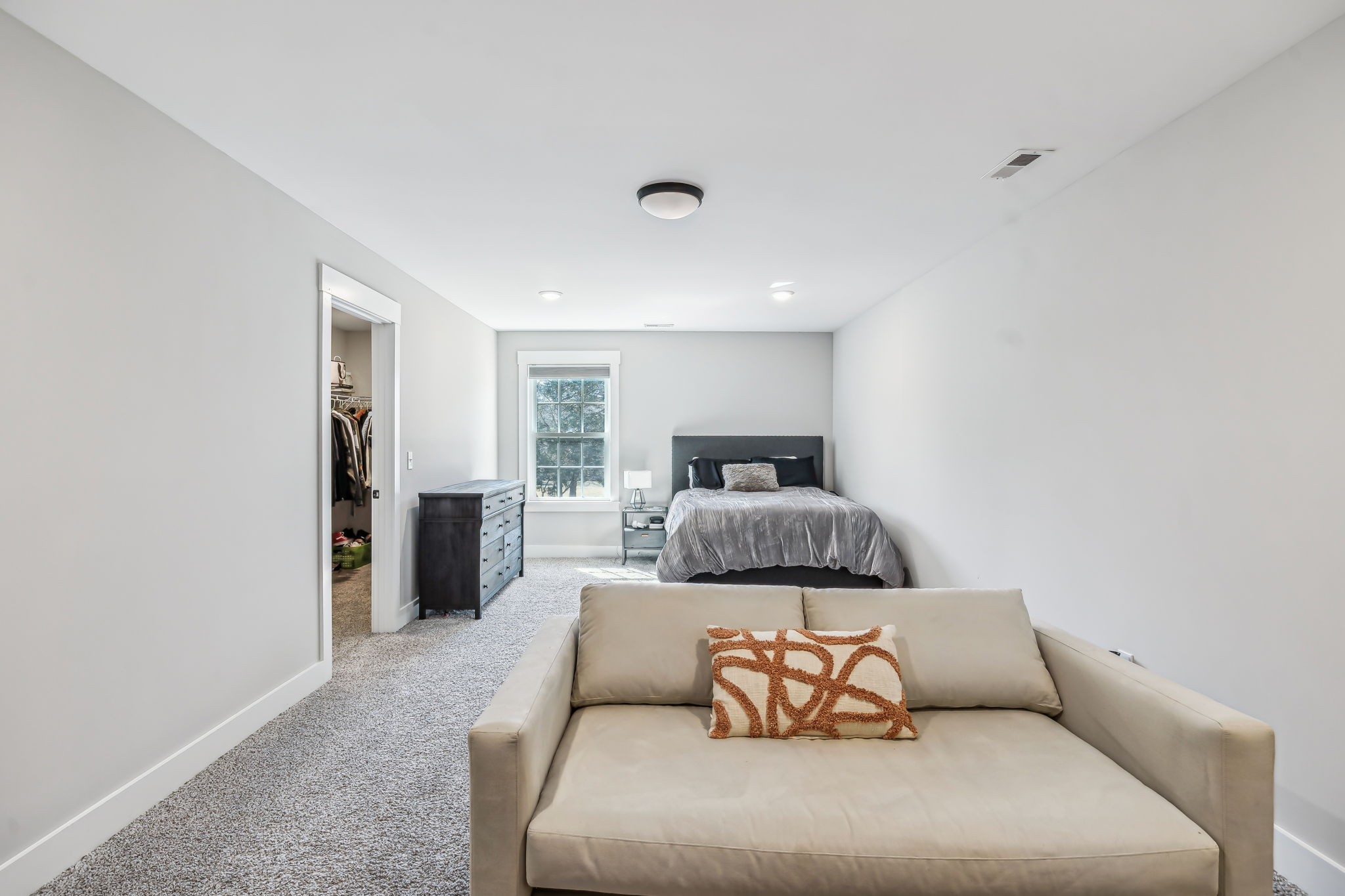 1567 Harrison Road Murfreesboro, TN 37128 - Photo 34 of 56 a bedroom with a large bed and a couch