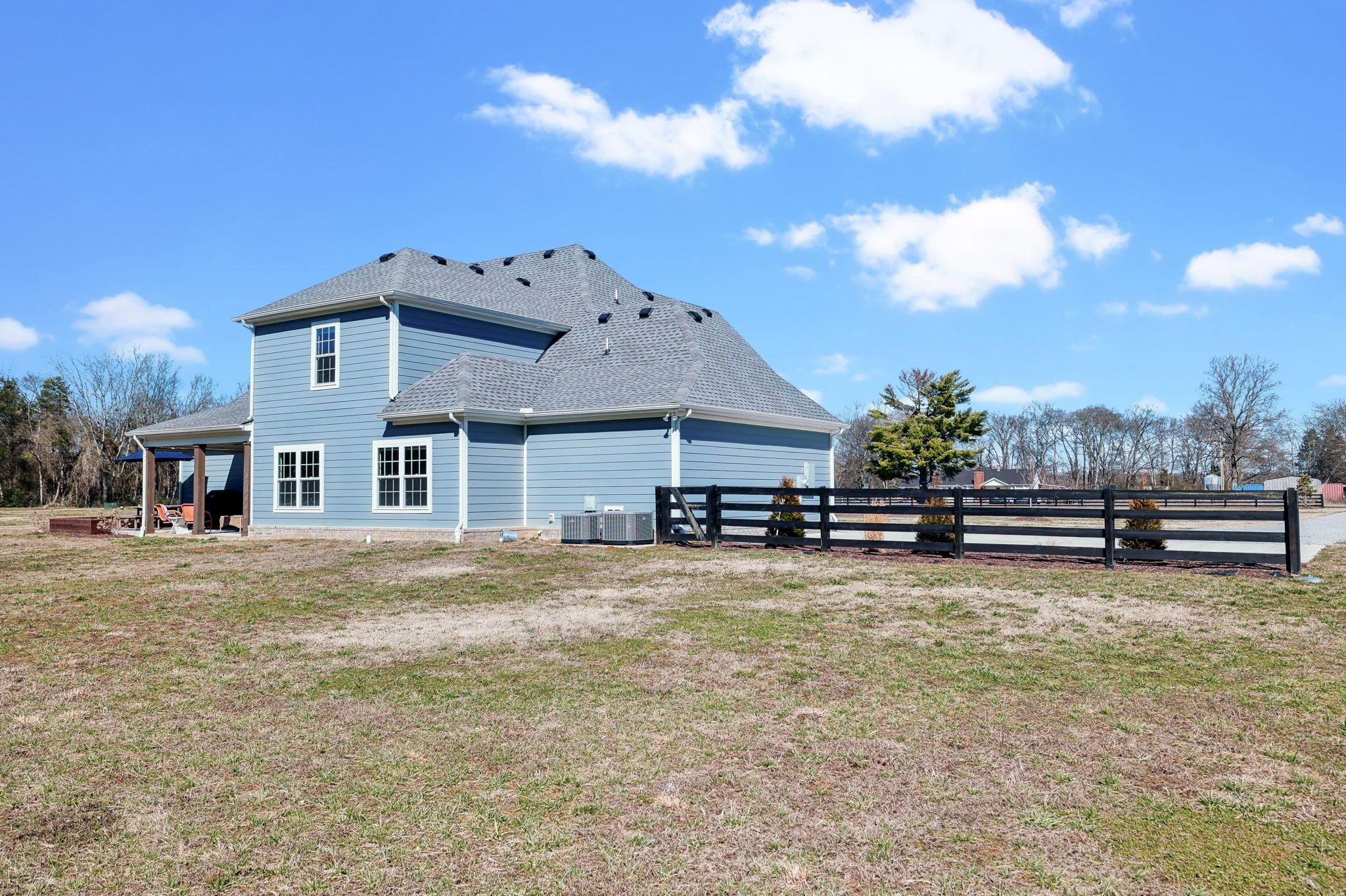 1567 Harrison Road Murfreesboro, TN 37128 - Photo 41 of 56 a view of a house with a big yard and a large tree