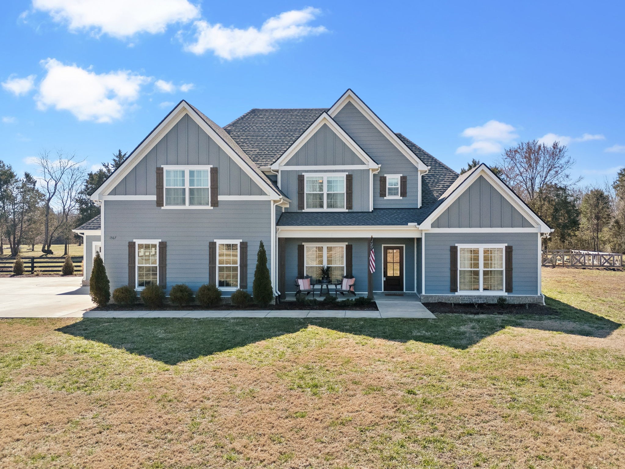 1567 Harrison Road Murfreesboro, TN 37128 - Photo 46 of 56 a front view of a house with a yard