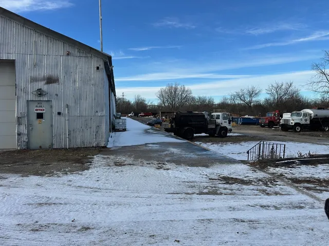 a view of a backyard with large trees