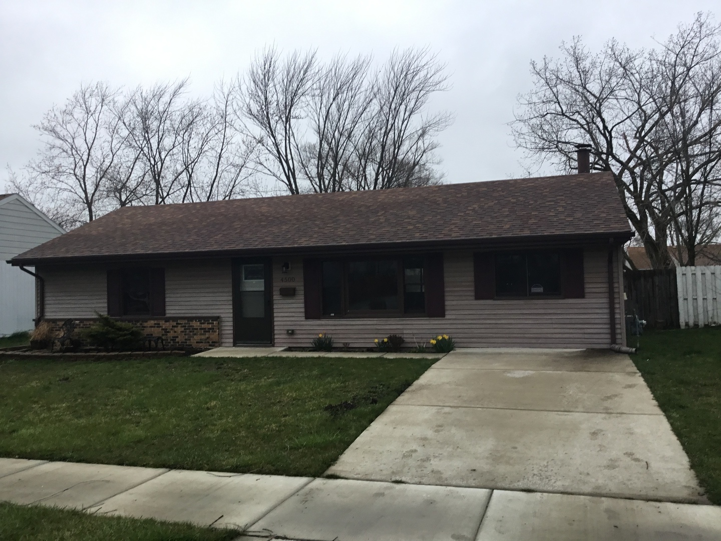 Undisclosed Address Richton Park, IL 60471 - Photo 1 of 11 a front view of a house with a yard and garage