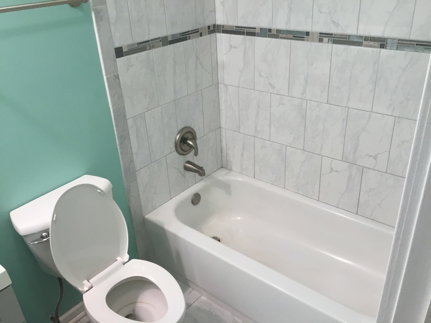 Undisclosed Address Richton Park, IL 60471 - Photo 7 of 11 a bathroom with a toilet and bathtub