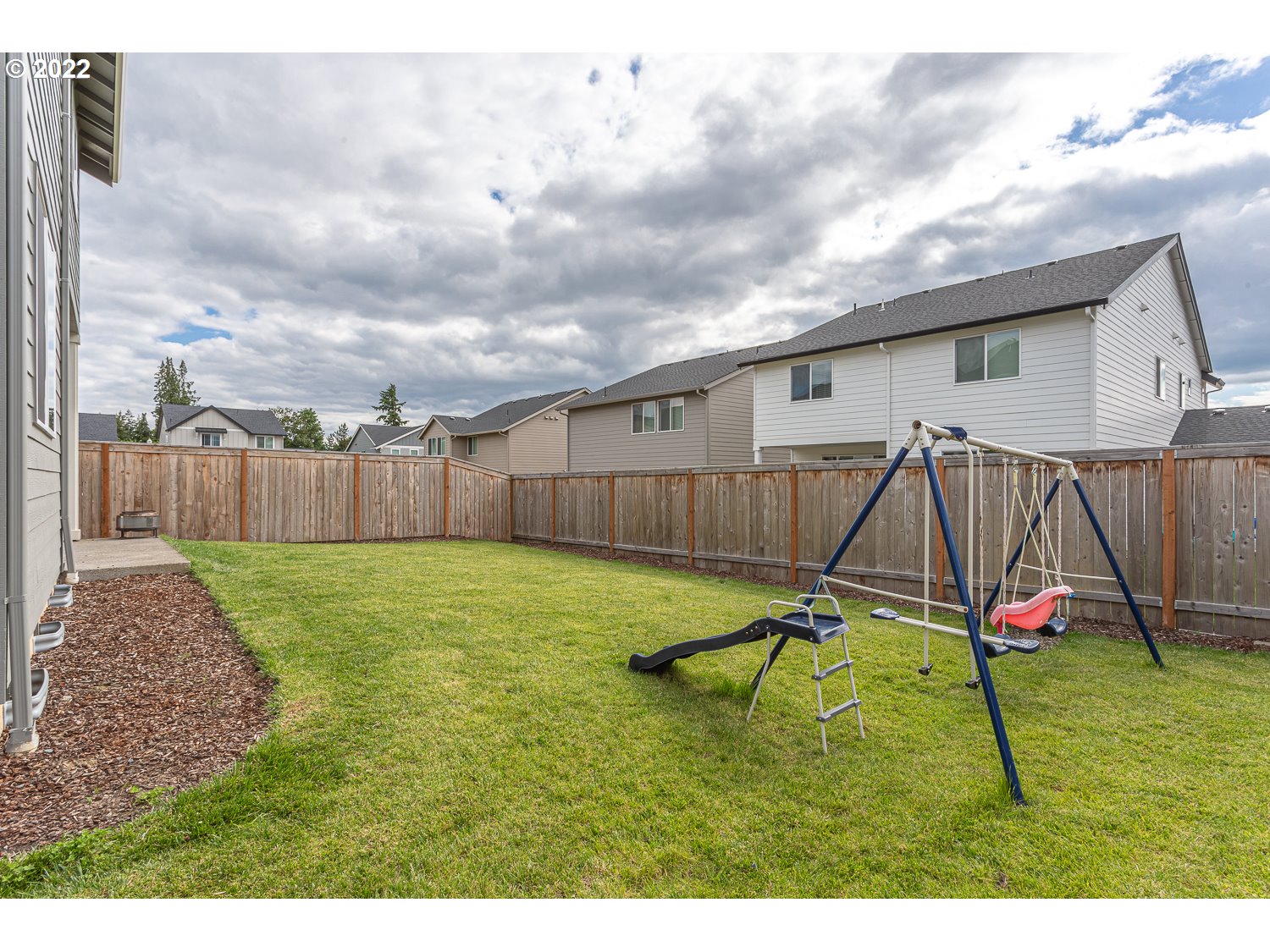 3821 South 41st Place Ridgefield, WA 98642 - Photo 16 of 32 a swimming pool with wooden fence