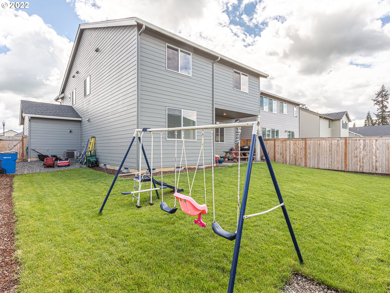 3821 South 41st Place Ridgefield, WA 98642 - Photo 19 of 32 a view of a house with a slide and a child swing