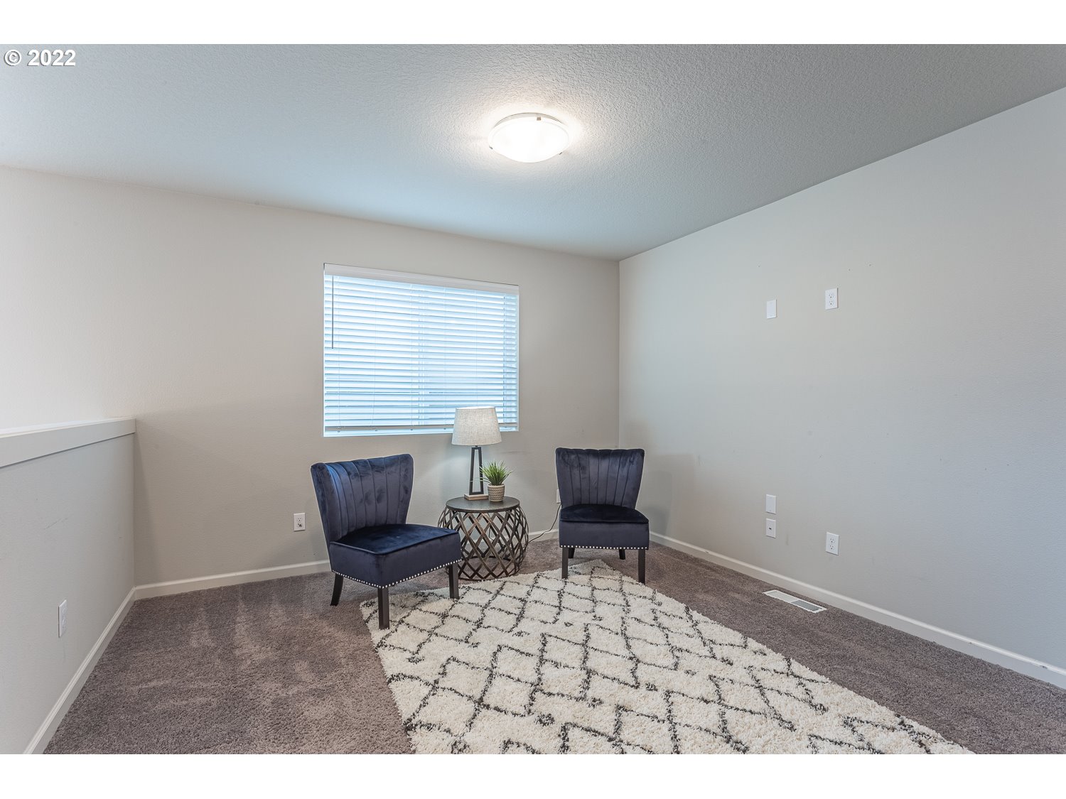 3821 South 41st Place Ridgefield, WA 98642 - Photo 21 of 32 a living room with furniture and a chair