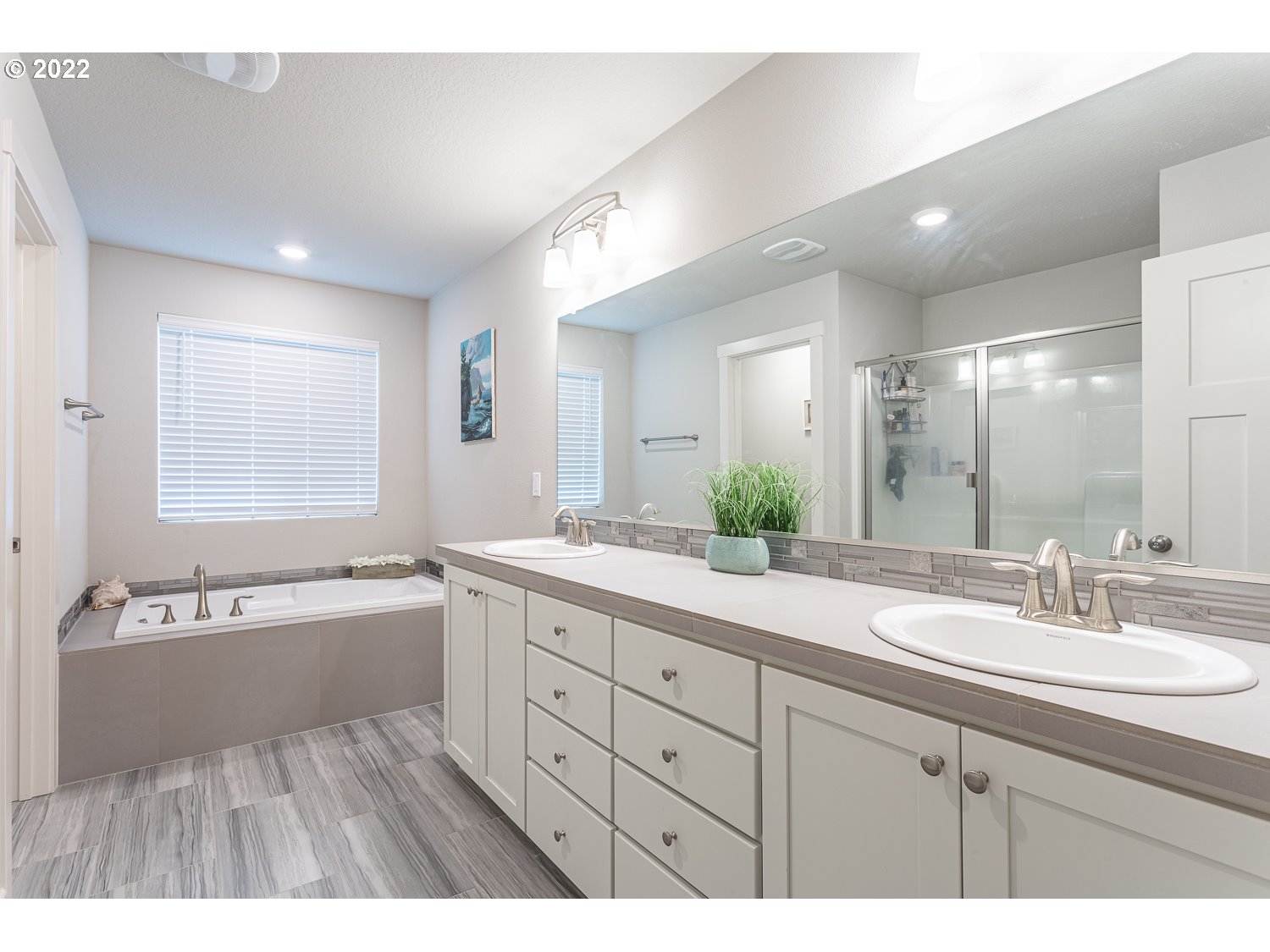 3821 South 41st Place Ridgefield, WA 98642 - Photo 23 of 32 a spacious bathroom with a granite countertop sink mirror and bathtub