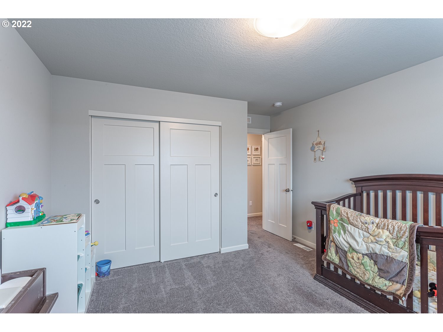 3821 South 41st Place Ridgefield, WA 98642 - Photo 27 of 32 a view of hallway with baby crib toys and couches