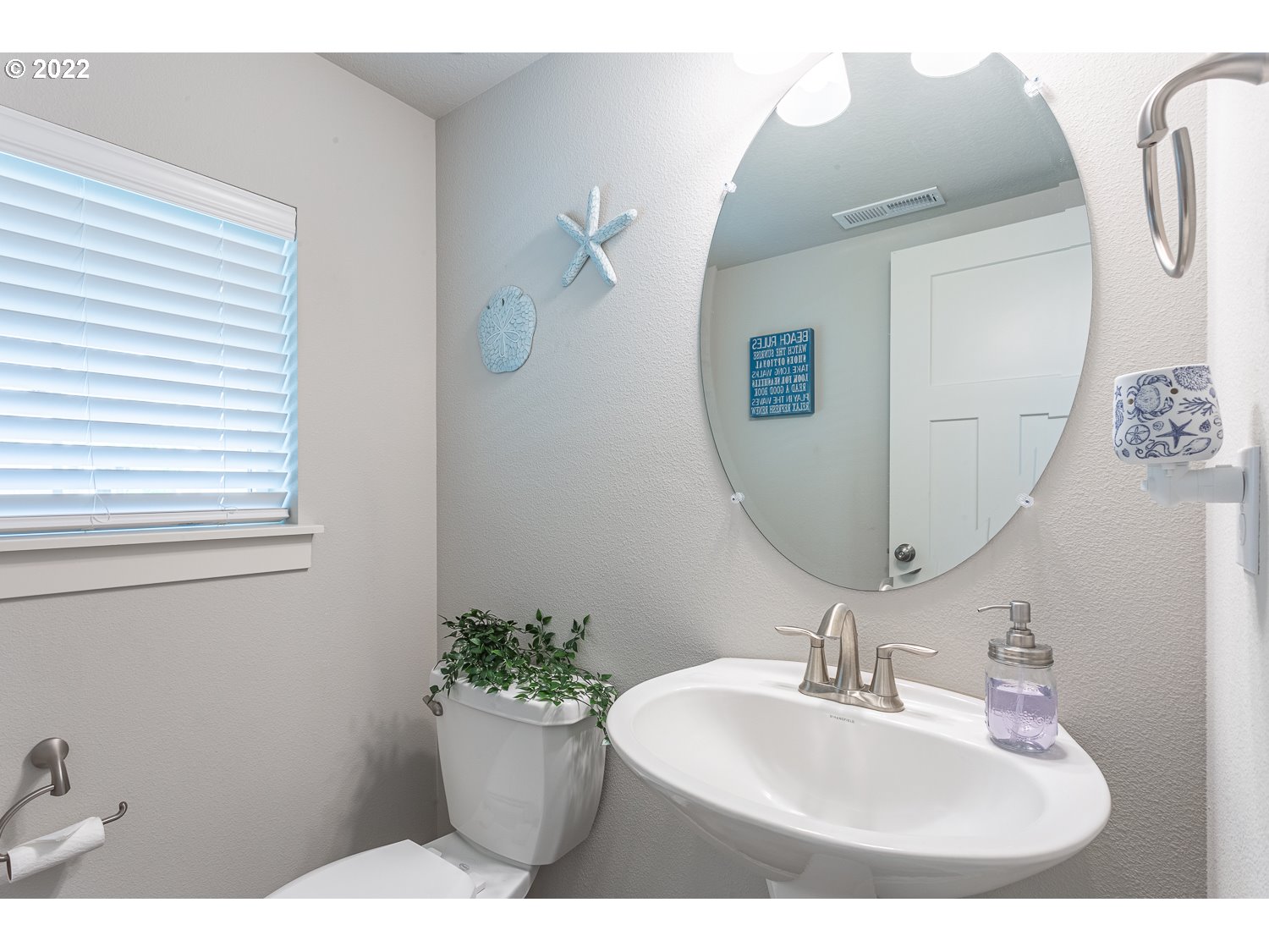 3821 South 41st Place Ridgefield, WA 98642 - Photo 3 of 32 a bathroom with a sink and mirror