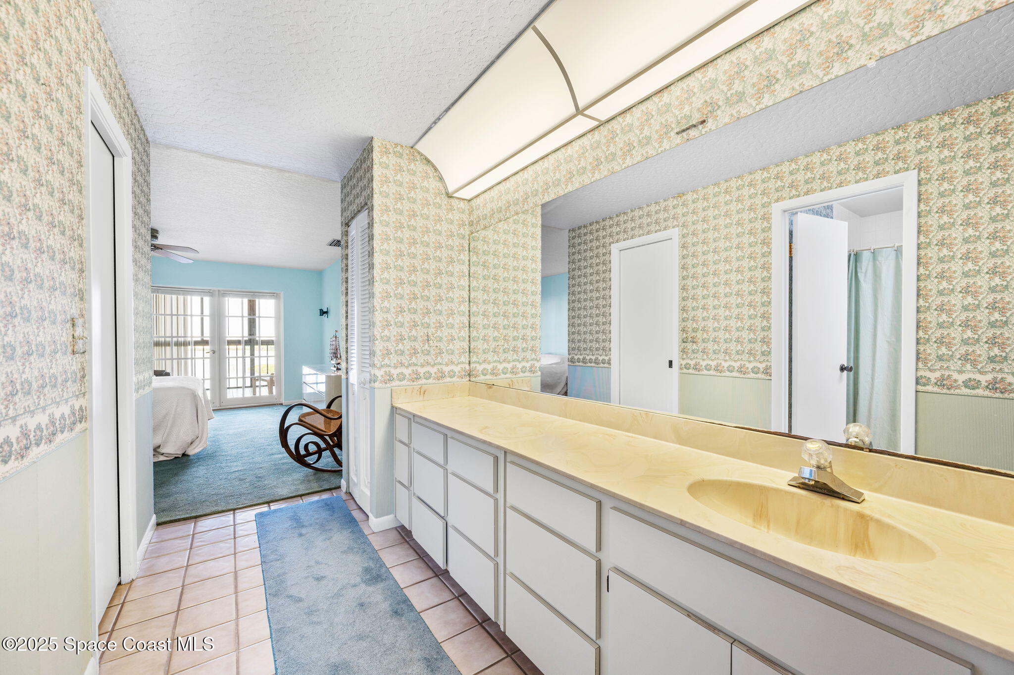 200 South Banana River Boulevard, Unit 2424 Cocoa Beach, FL 32931 - Photo 11 of 18 a spacious bathroom with a tub sink and mirror