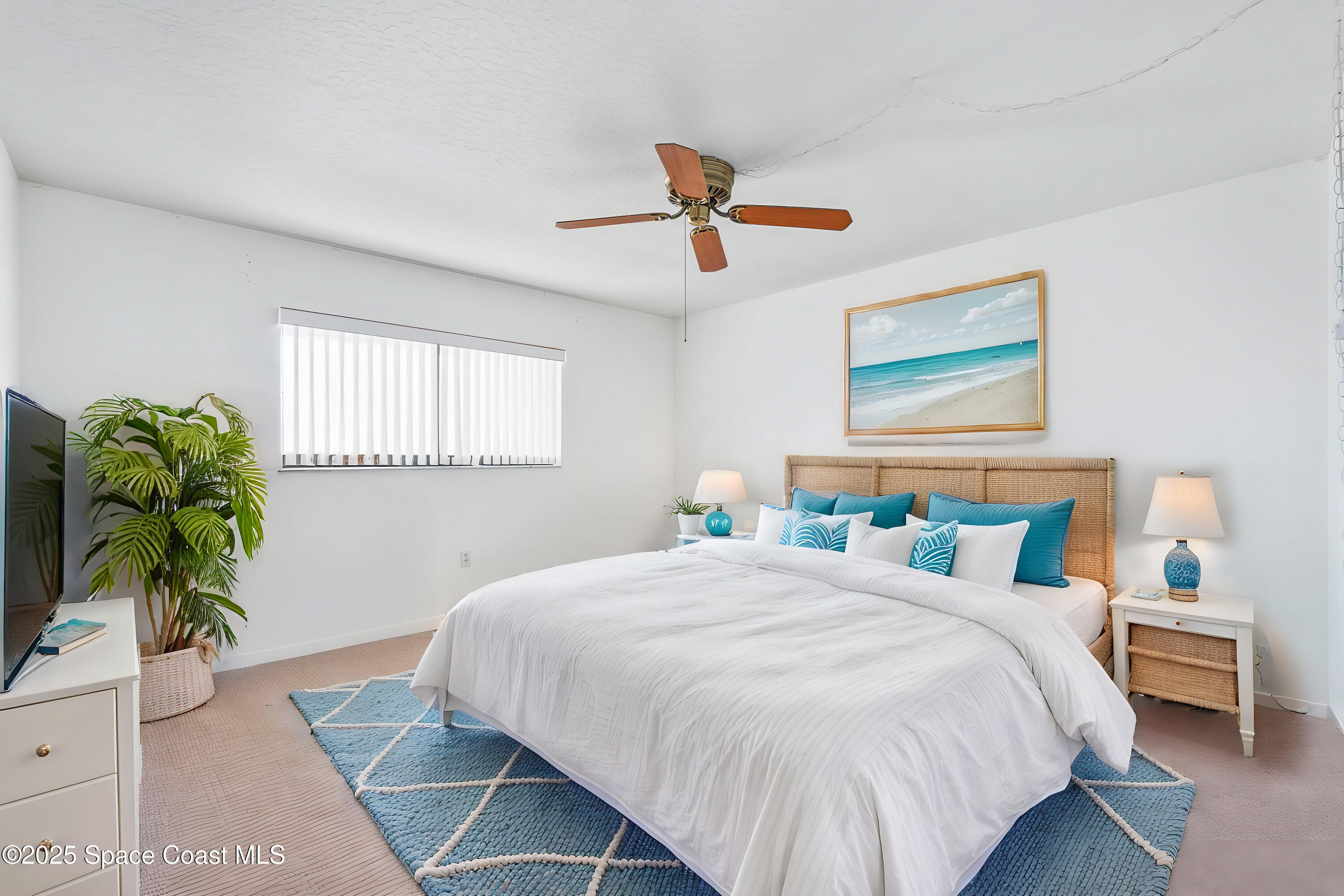 200 South Banana River Boulevard, Unit 2424 Cocoa Beach, FL 32931 - Photo 12 of 18 a bedroom with a bed and a potted plant
