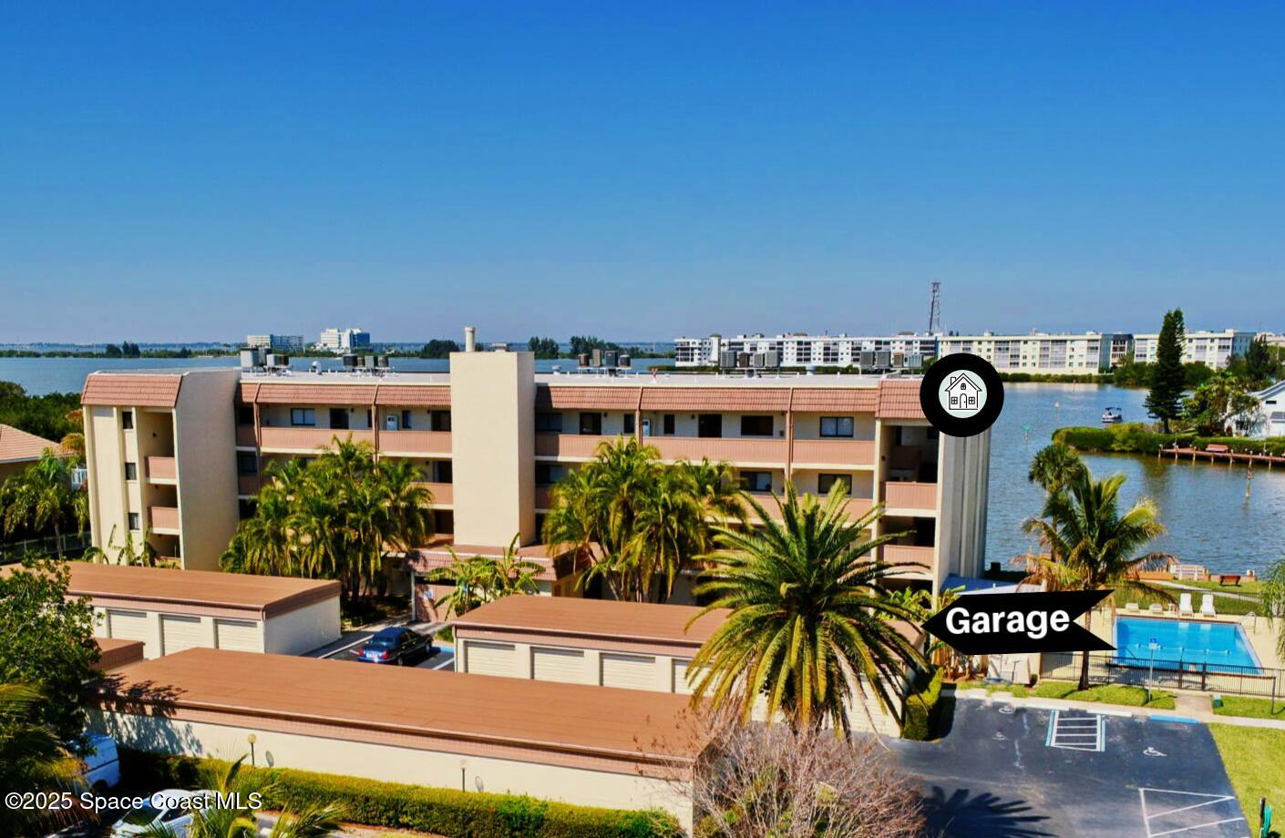 200 South Banana River Boulevard, Unit 2424 Cocoa Beach, FL 32931 - Photo 2 of 18 a view of building with outdoor space and seating area