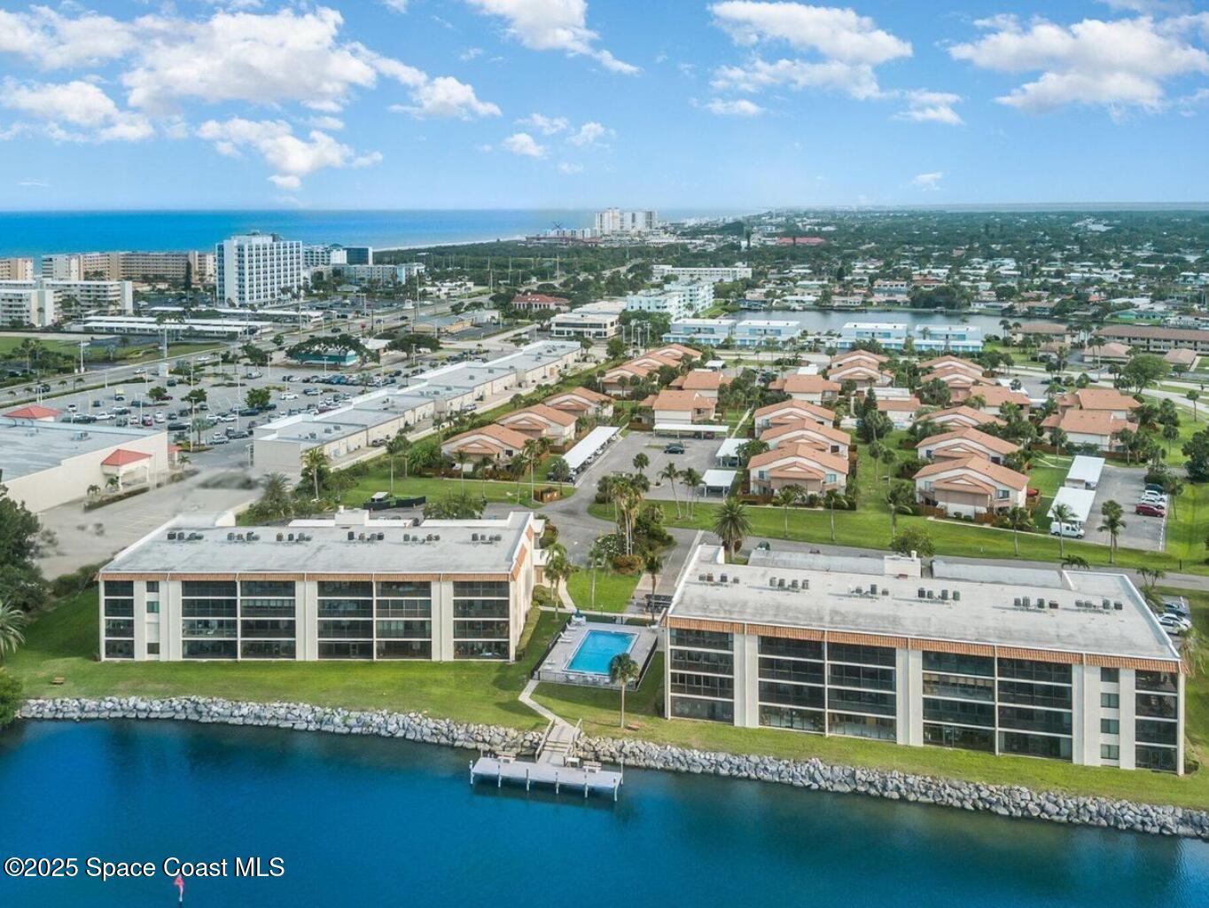 200 South Banana River Boulevard, Unit 2424 Cocoa Beach, FL 32931 - Photo 3 of 18 a view of a large building with a lot of buildings