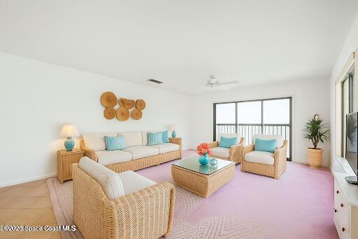 200 South Banana River Boulevard, Unit 2424 Cocoa Beach, FL 32931 - Photo 8 of 18 a living room with furniture and a large window