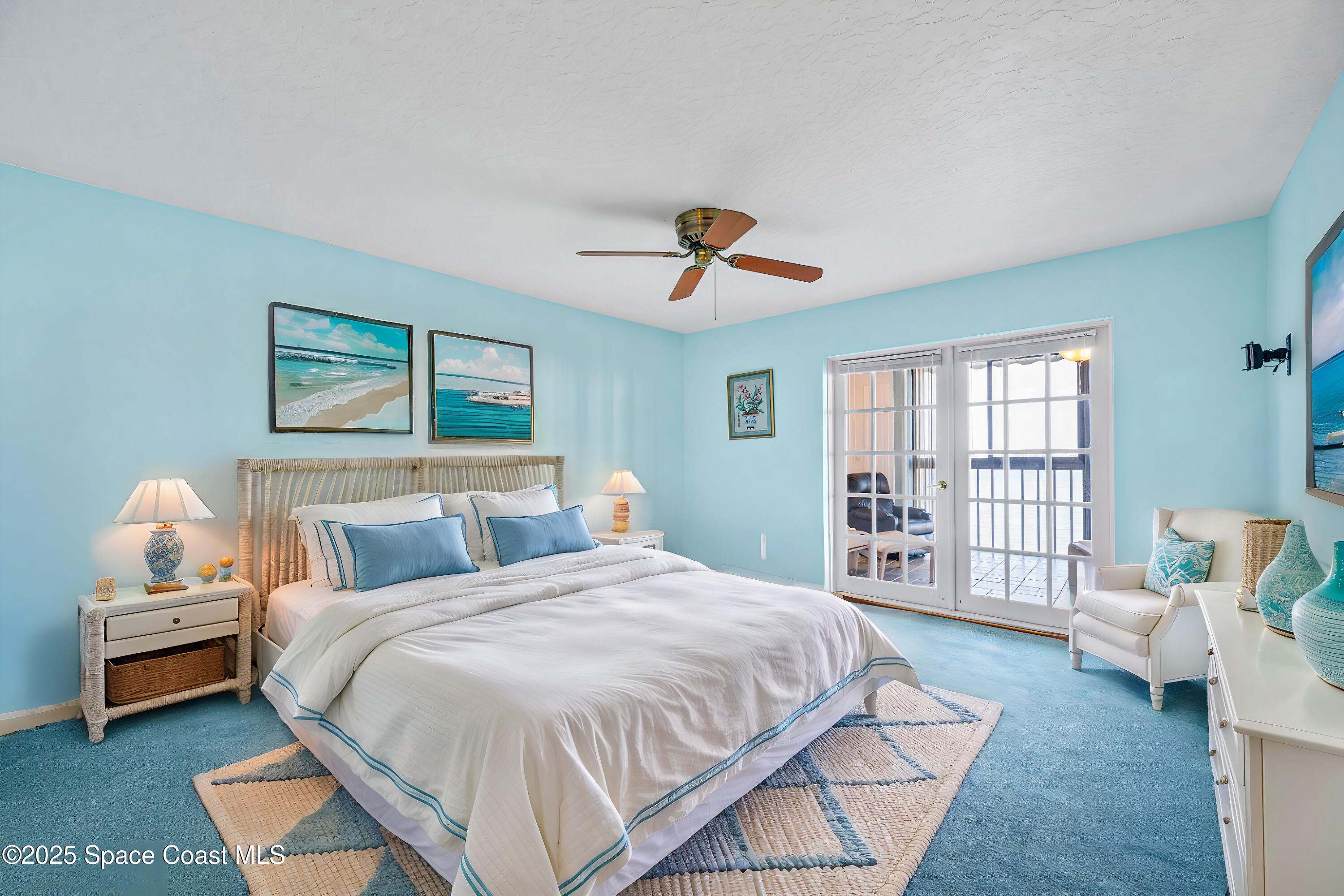 200 South Banana River Boulevard, Unit 2424 Cocoa Beach, FL 32931 - Photo 9 of 18 a bedroom with a bed a couch and a window