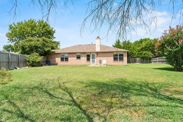 a front view of a house with yard