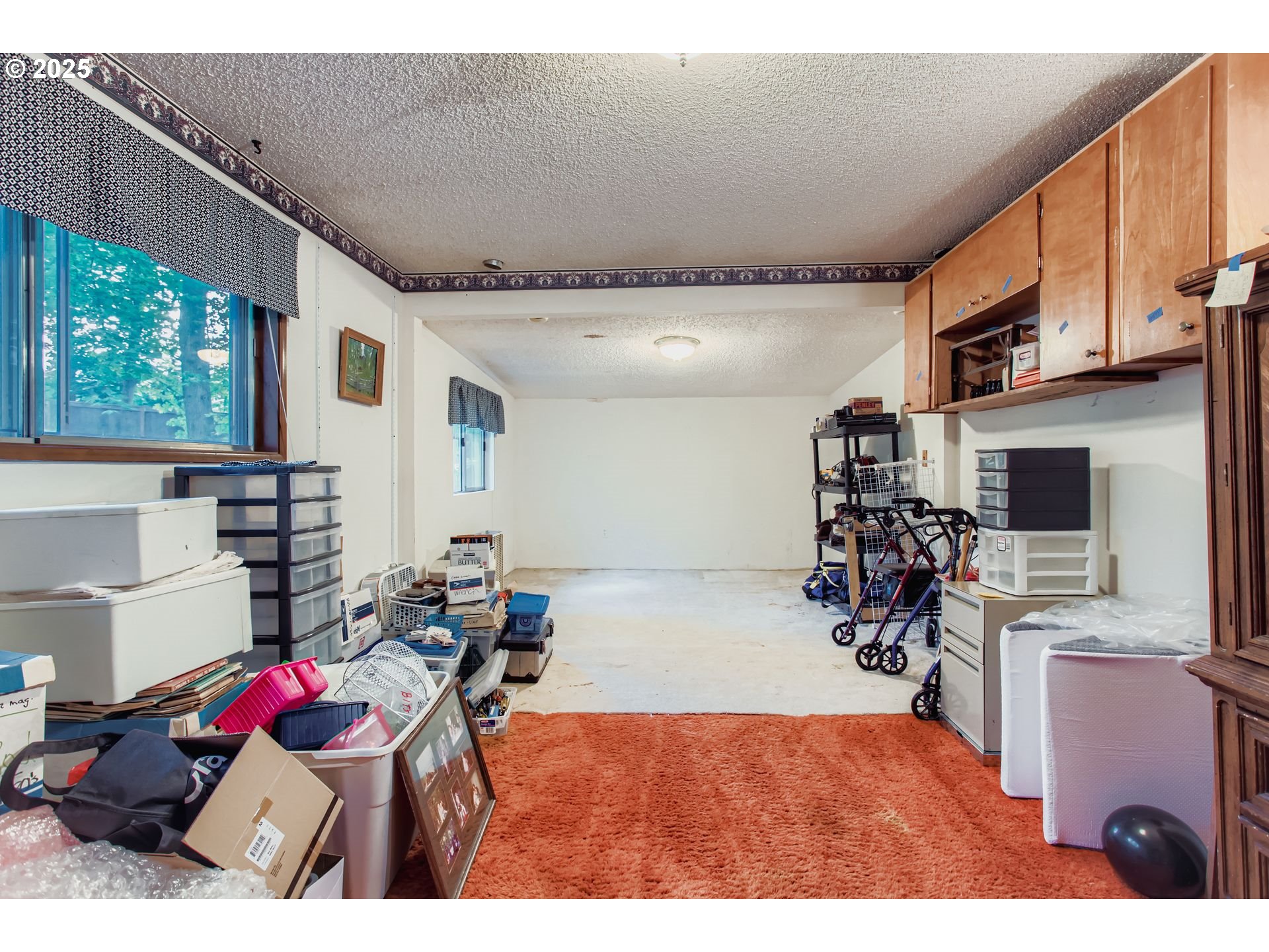 4201 Southwest Childs Road Lake Oswego, OR 97034 - Photo 13 of 37 a bedroom with furniture a flat screen tv and a window