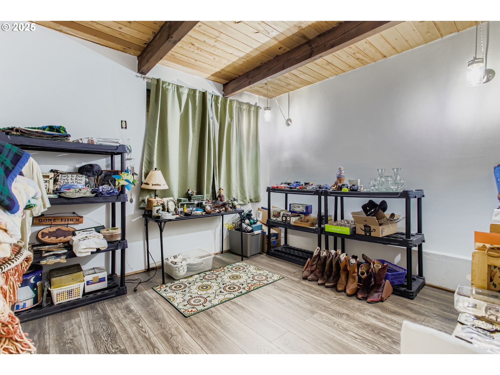 4201 Southwest Childs Road Lake Oswego, OR 97034 - Photo 16 of 37 a living room with lots of furniture and clutter