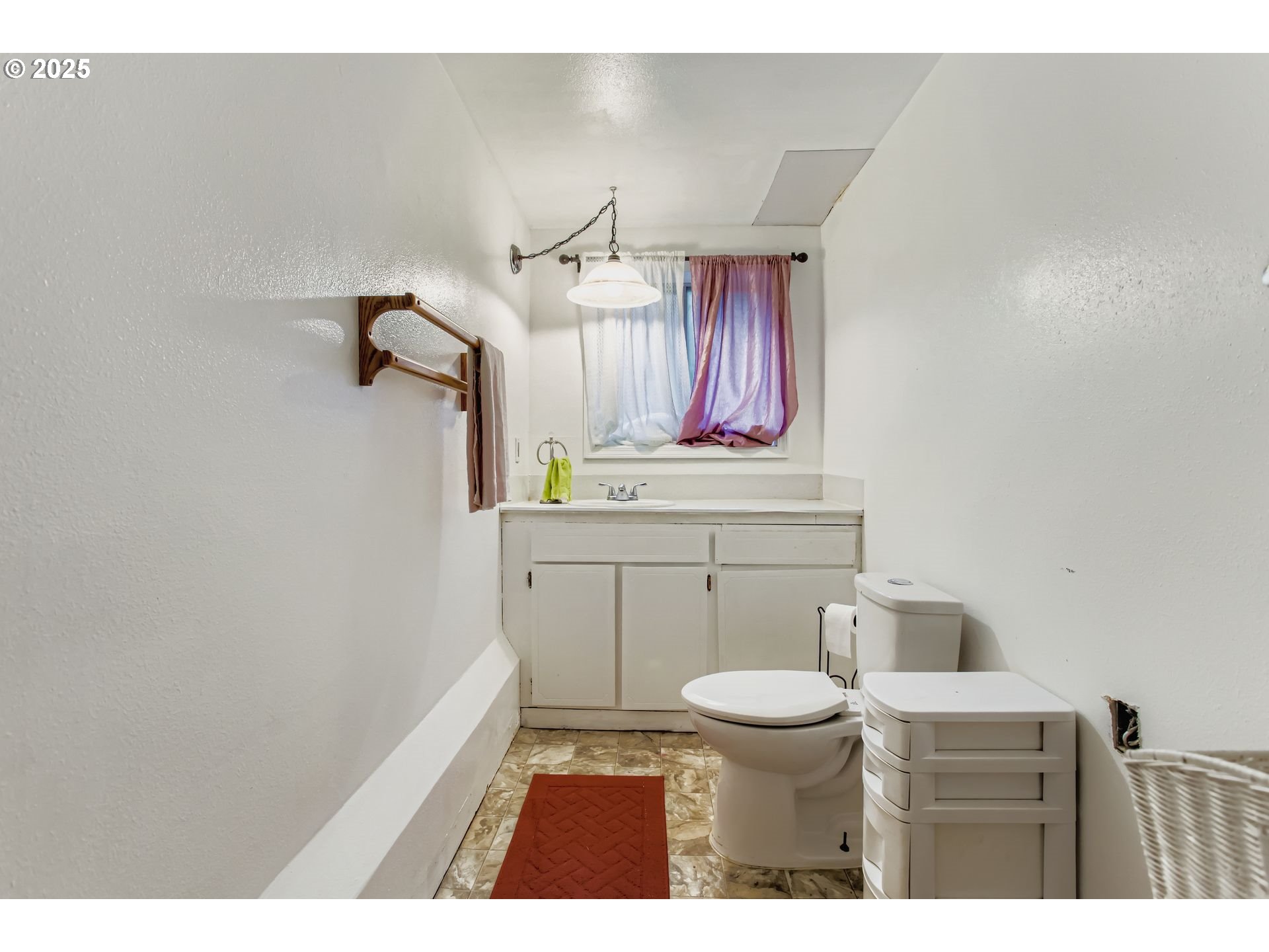 4201 Southwest Childs Road Lake Oswego, OR 97034 - Photo 17 of 37 a bathroom with a sink a toilet and a mirror