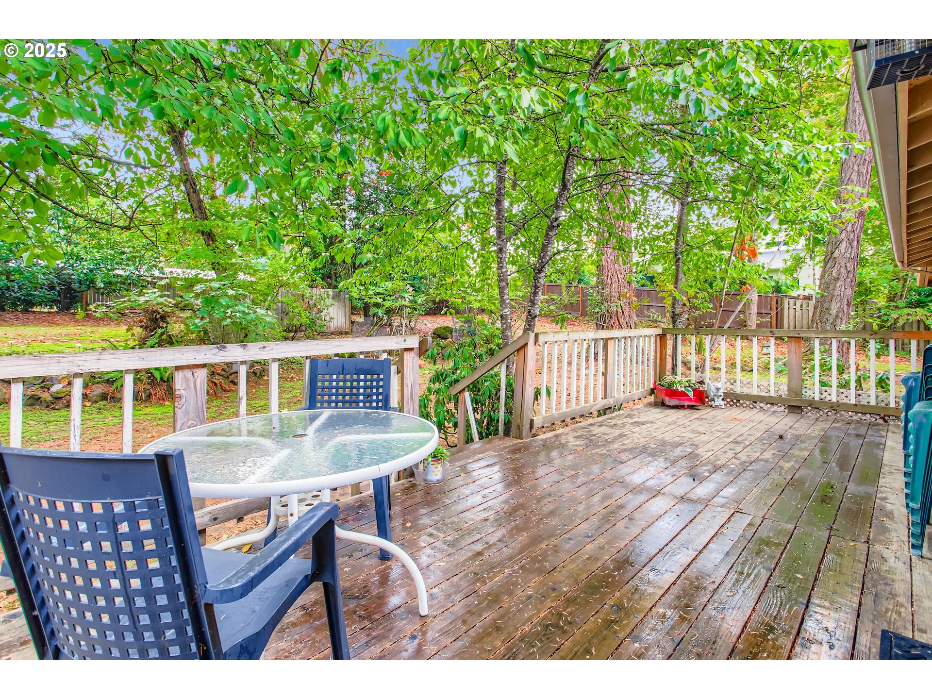 4201 Southwest Childs Road Lake Oswego, OR 97034 - Photo 18 of 37 a backyard of a house with table and chairs