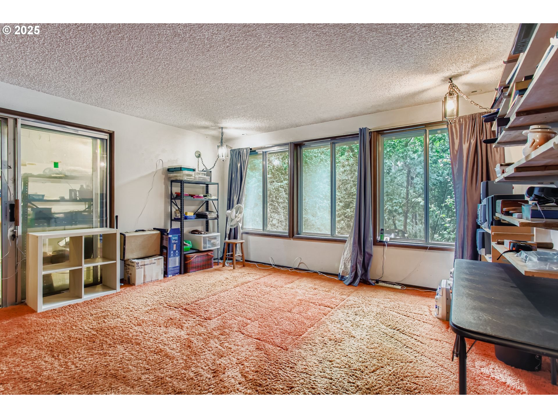 4201 Southwest Childs Road Lake Oswego, OR 97034 - Photo 10 of 37 a bedroom with furniture and a large window