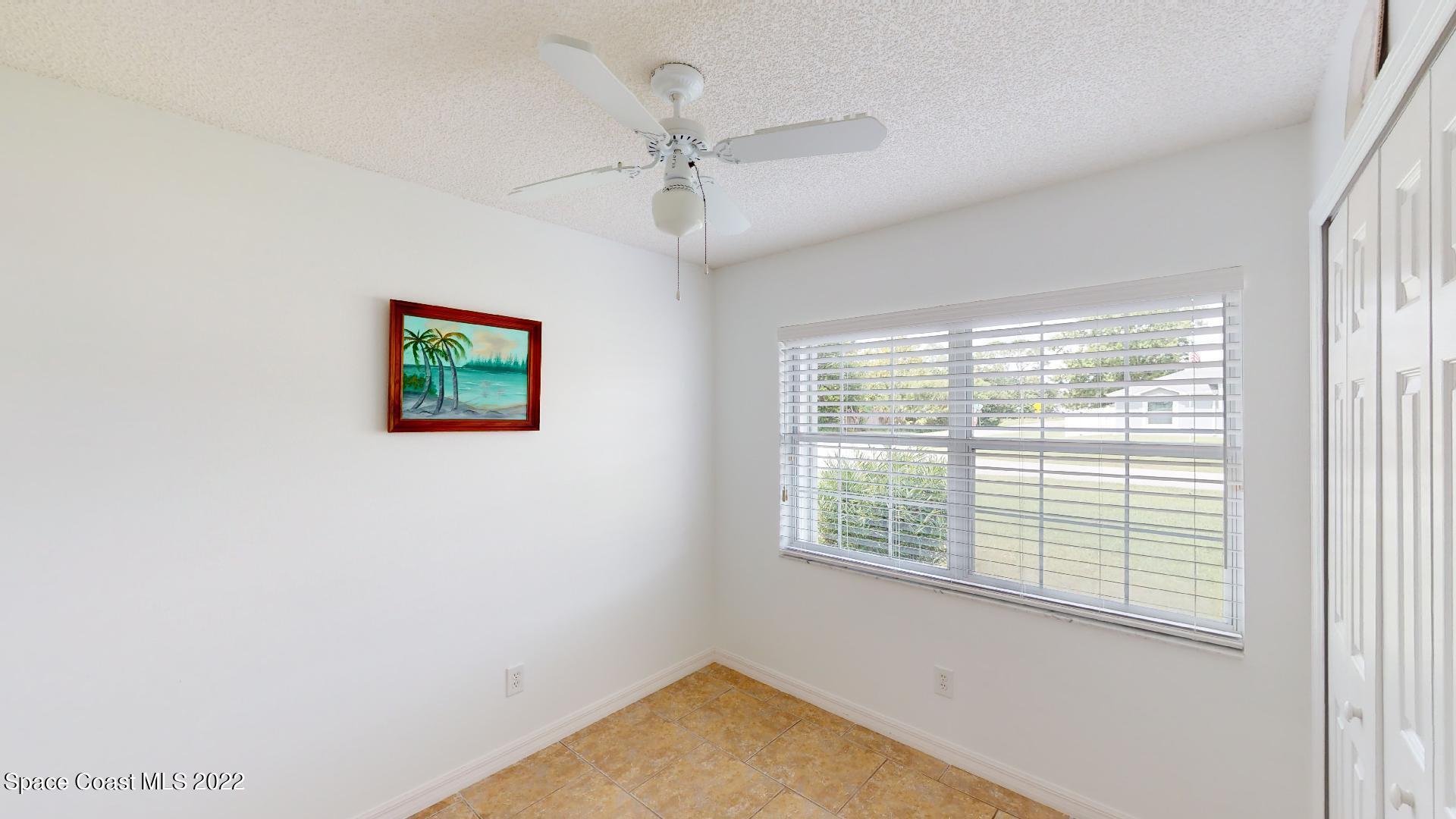 6801 Cecil Road Cocoa, FL 32927 - Photo 18 of 66 a view of an empty room with a window