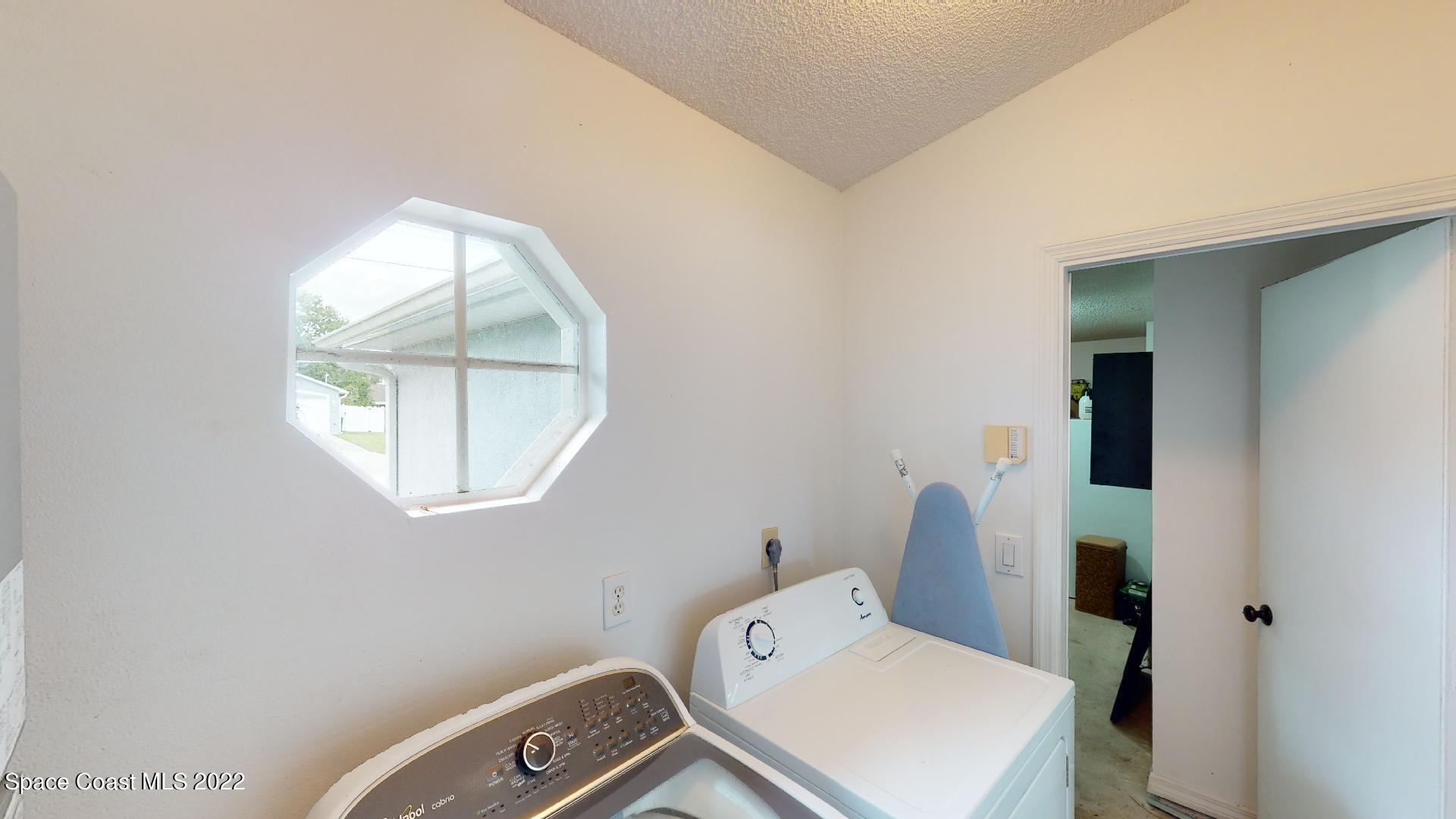 6801 Cecil Road Cocoa, FL 32927 - Photo 29 of 66 wooden floor and window in a bathroom