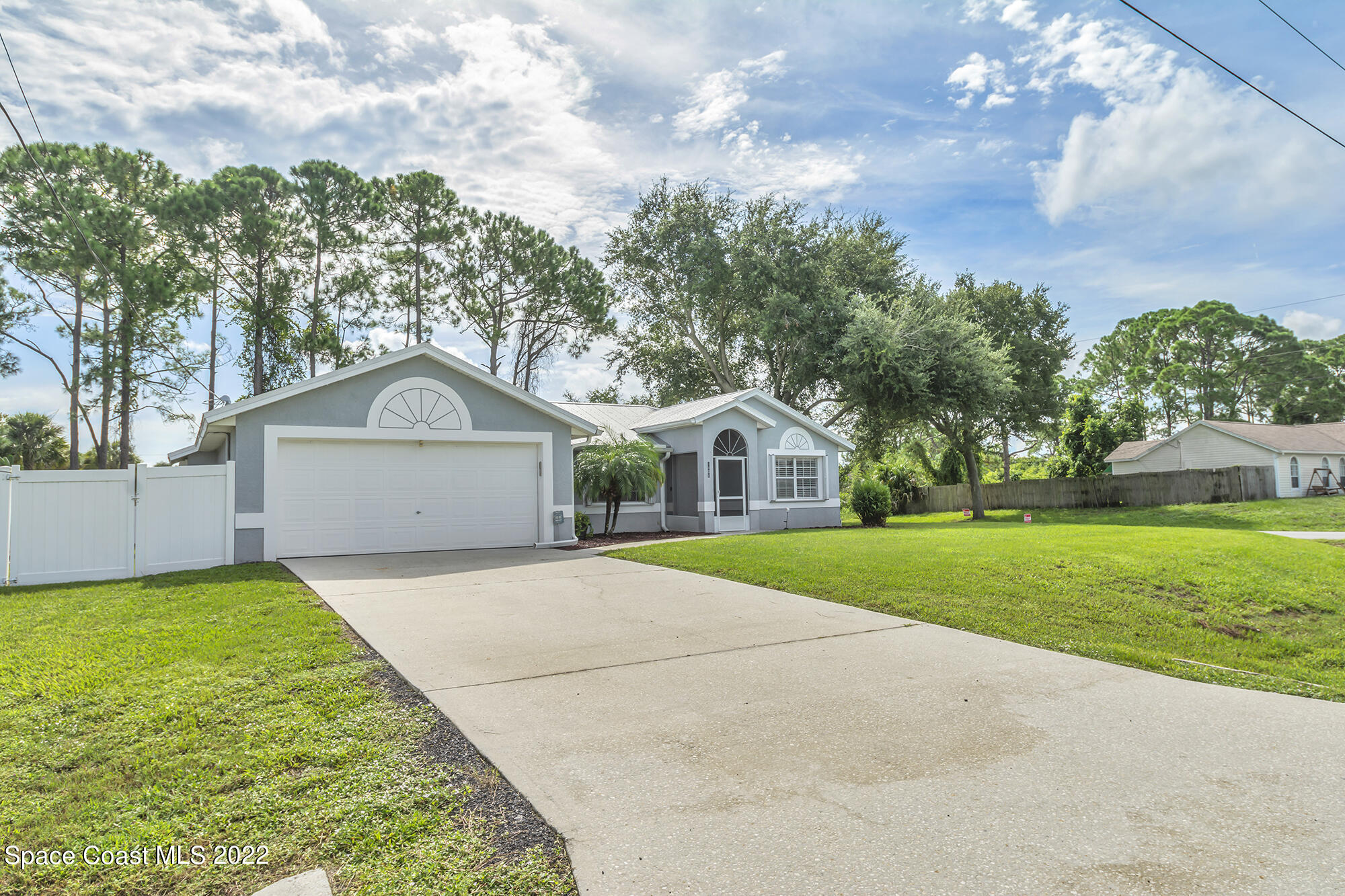 6801 Cecil Road Cocoa, FL 32927 - Photo 3 of 66 a front view of a house with garden
