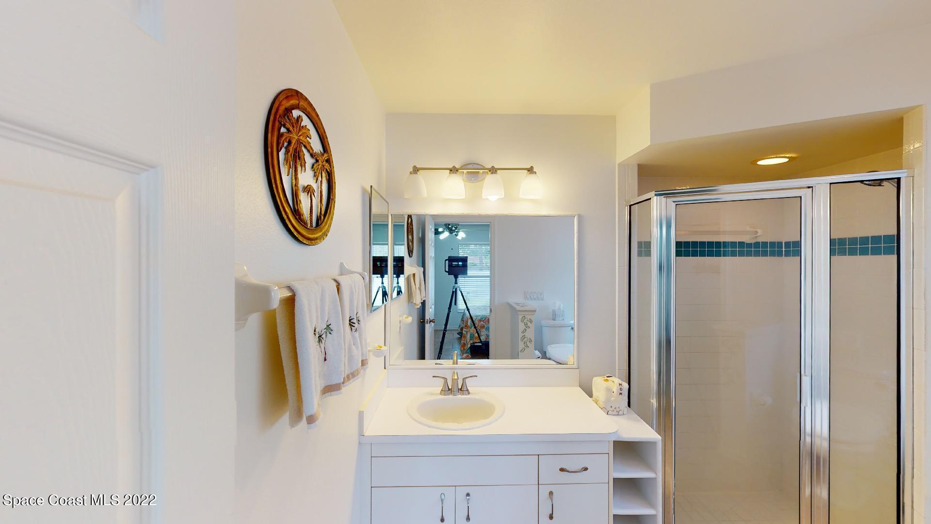6801 Cecil Road Cocoa, FL 32927 - Photo 42 of 66 a bathroom with a sink and a mirror