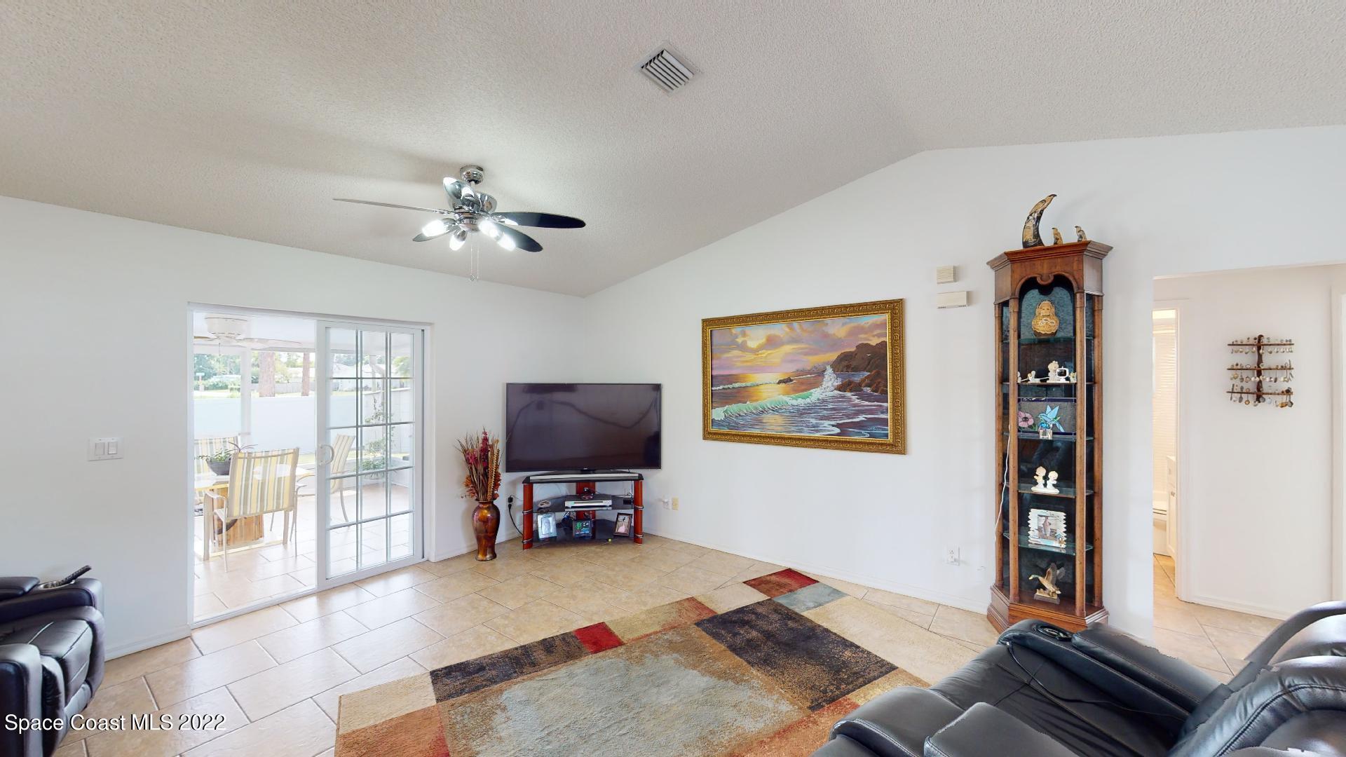 6801 Cecil Road Cocoa, FL 32927 - Photo 8 of 66 a living room with furniture and a window