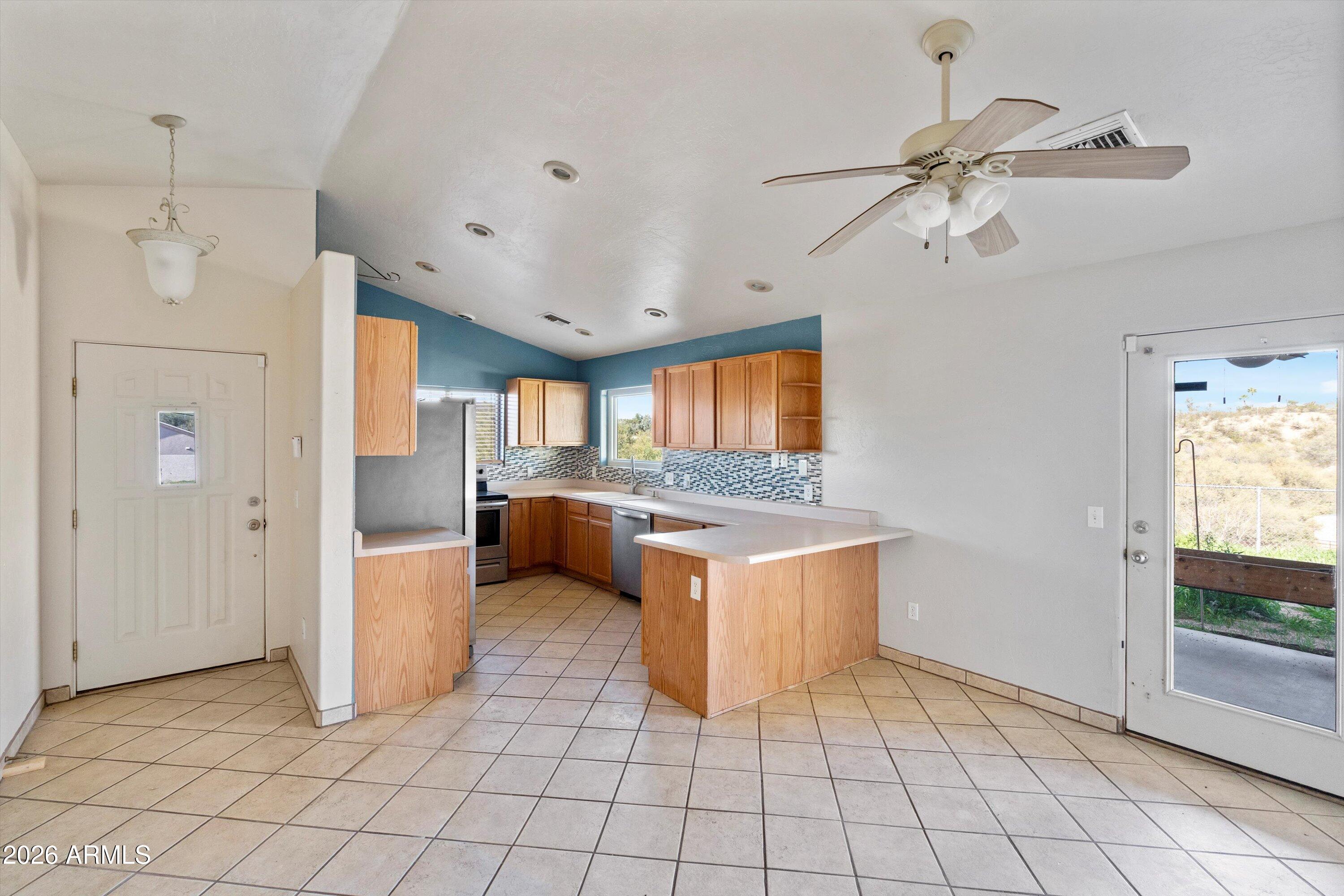 51224 North Mockingbird Road Wickenburg, AZ 85390 - Photo 5 of 31 05-Family Room to Kitchen